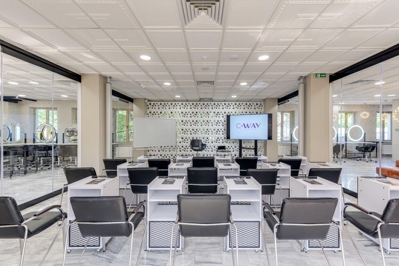 Spacious conference room featuring modern design, ideal for business meetings and presentations.